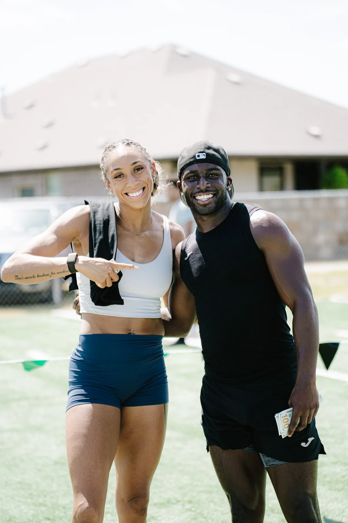 Austin champions Ashley Tinashe Miller and Marcellus Moore together after the finals